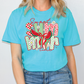 a woman wearing a blue shirt with a watermelon graphic on it