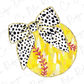 a yellow and black polka dot bow on a white background