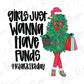 a woman carrying a christmas tree with a shopping bag