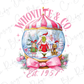 a snow globe with a pink bow around it