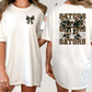 A woman wearing a white t-shirt with a bow and the word "GATORS" printed on the back.
