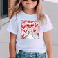 A young girl wearing a white t-shirt with a graphic design of a duck wearing sunglasses and surrounded by hearts.