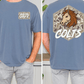 a man wearing a blue t-shirt with a graphic design on the back. The design features a horse's head with a camouflage pattern and the word "COLTS" written below it.