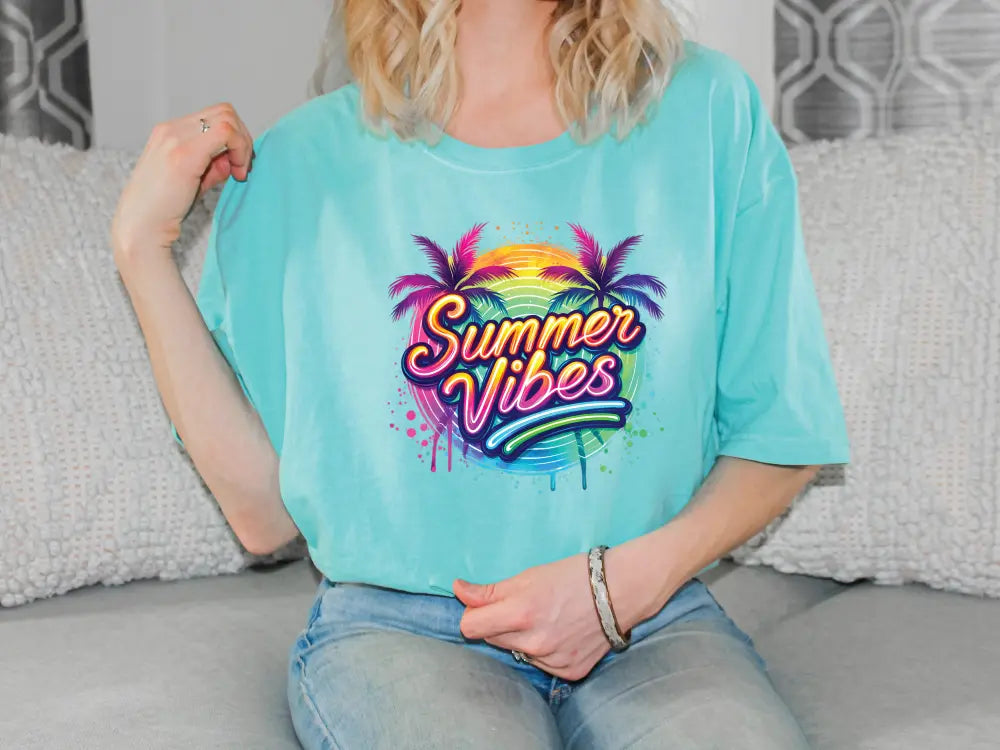 a woman sitting on a couch wearing a t - shirt that says summer vibes