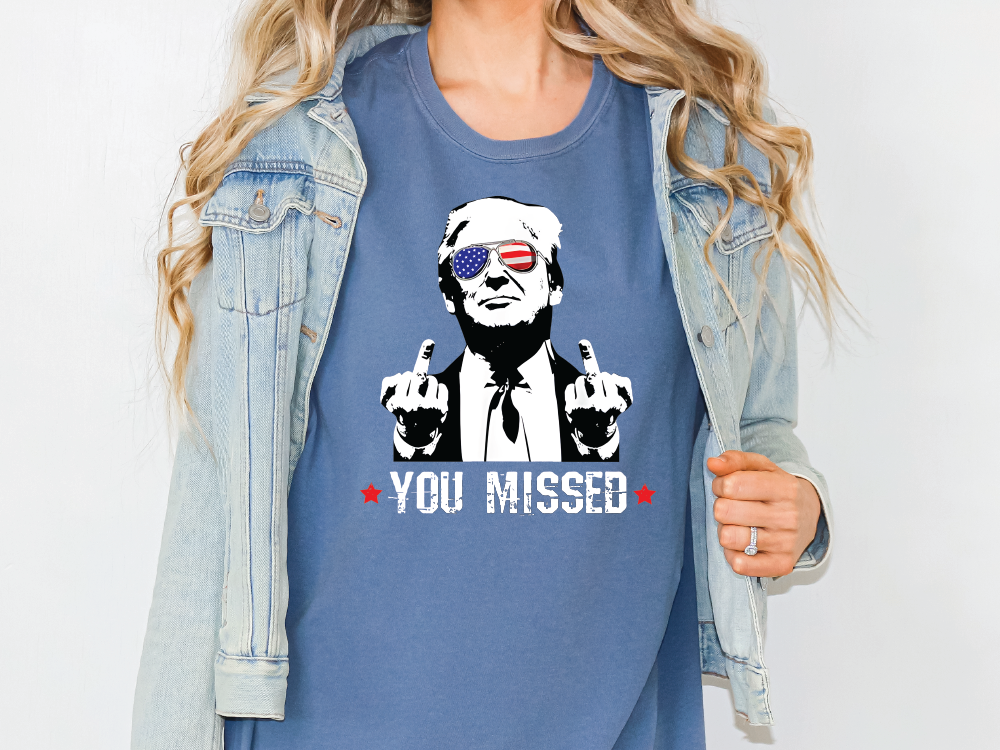 a woman wearing a t - shirt that says you missed