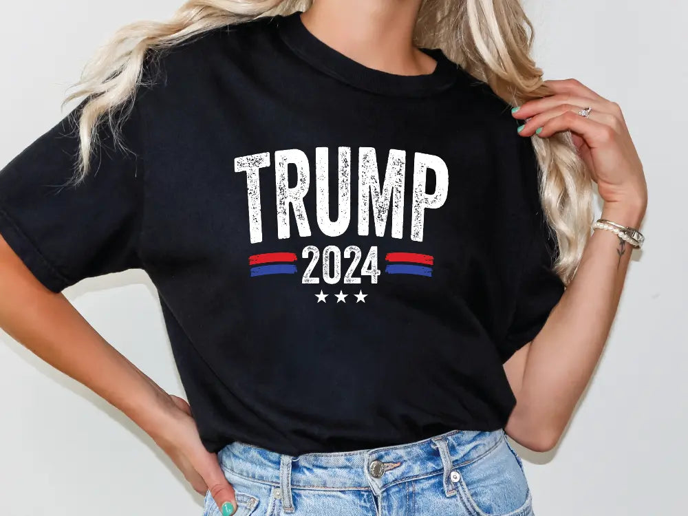 a woman wearing a black trump t - shirt