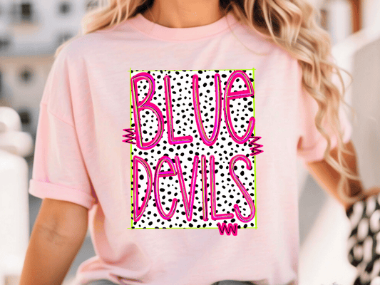 A woman wearing a pink t-shirt with the text "BLUE DEVILS" printed on it.