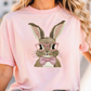 a woman wearing a pink shirt with a bunny wearing glasses