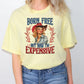 a woman wearing a yellow shirt with a picture of a woman wearing a cowboy hat