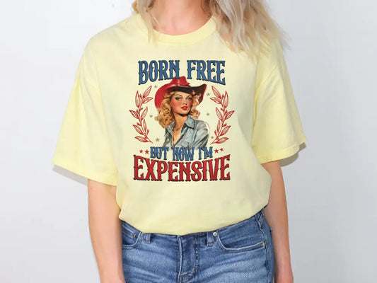 a woman wearing a yellow shirt with a picture of a woman wearing a cowboy hat