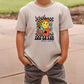 a young boy wearing a t - shirt with a cartoon character on it