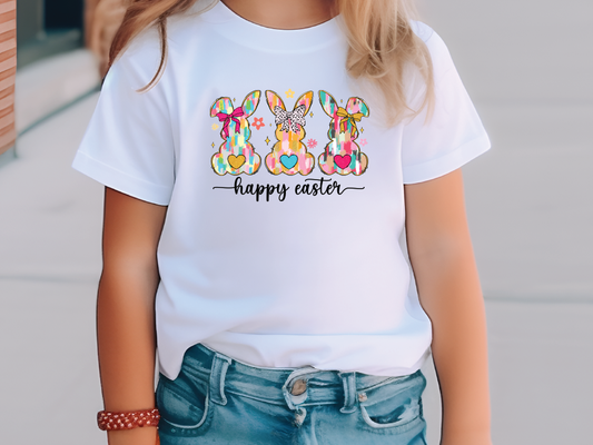 a little girl wearing a happy easter bunny t - shirt