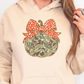 a woman wearing a hoodie with a bow on it