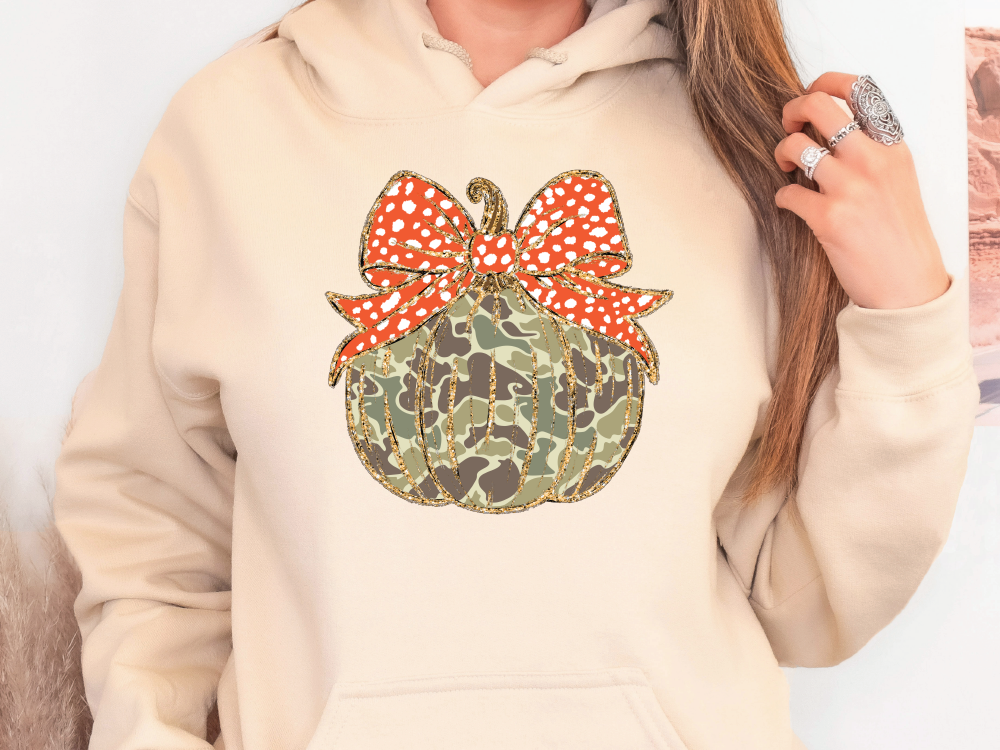 a woman wearing a hoodie with a bow on it