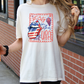 a woman holding a cup of coffee and wearing a t - shirt