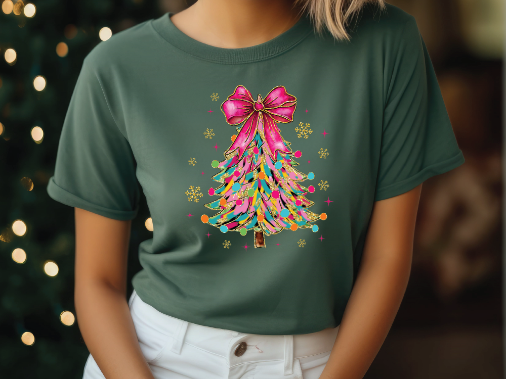 a woman wearing a green t - shirt with a colorful christmas tree on it