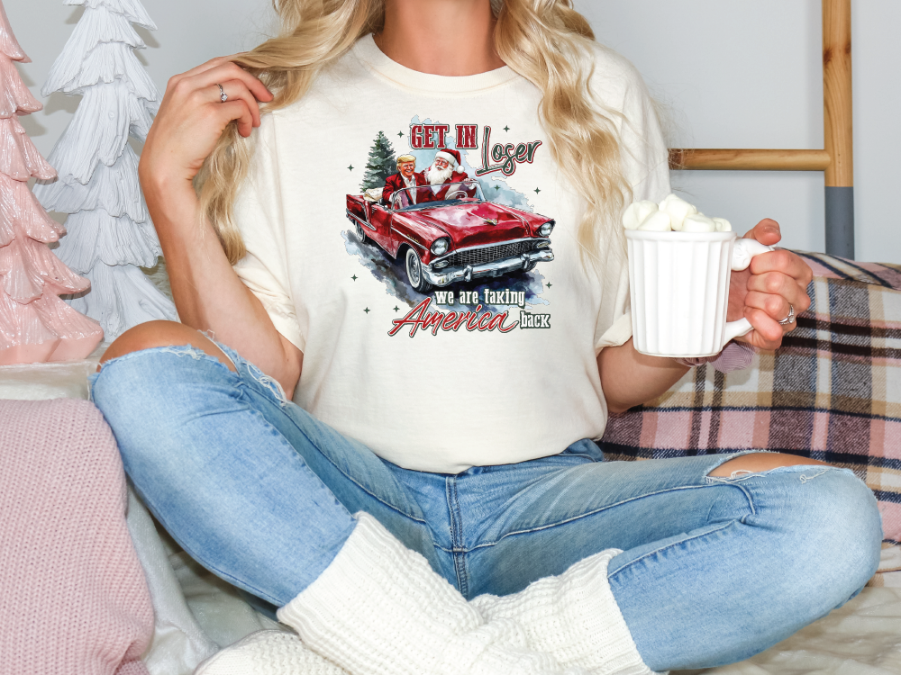 a woman sitting on a bed holding a cup of coffee