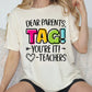 a woman sitting on a couch wearing a t - shirt that says dear parents tag