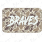 A camouflage-patterned object with the word "Braves" written in a bold, white font.