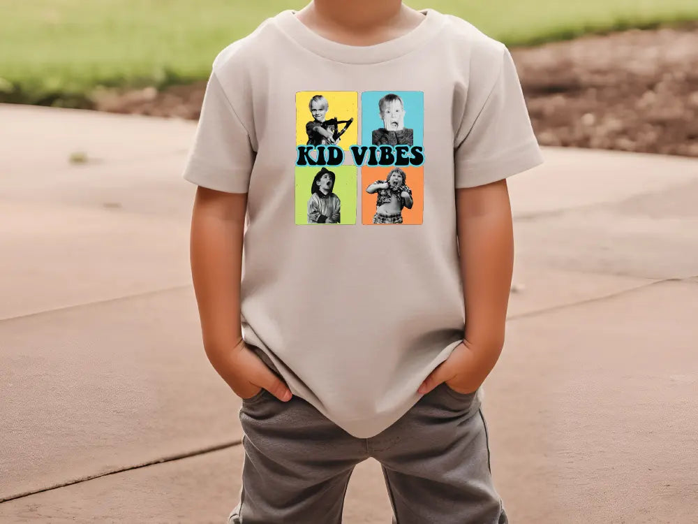 a young boy wearing a t - shirt with the words kid vibes on it