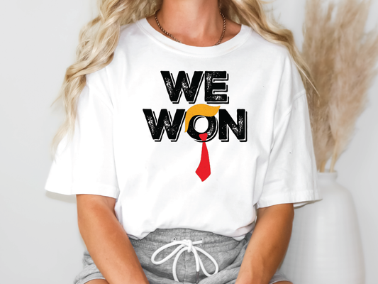 a woman wearing a t - shirt that says we won