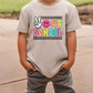 a young boy wearing a t - shirt that says out school