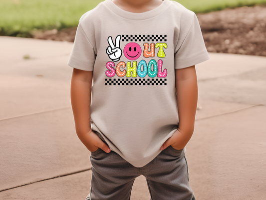 a young boy wearing a t - shirt that says out school
