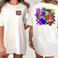 A white t-shirt with a graphic design on the back, featuring a checkered pattern, a leopard, and colorful stars and shapes.