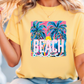 a woman wearing a yellow beach t - shirt with palm trees on it