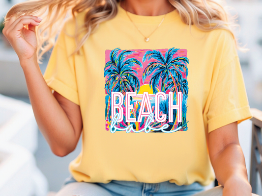 a woman wearing a yellow beach t - shirt with palm trees on it