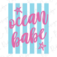 a vibrant and playful design with the text "ocean babe" written in a cursive pink font against a background of blue and white striped vertical lines. There are also two pink stars positioned above the text.