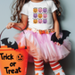 a little girl in a trick or treat costume holding a trick or treat bucket