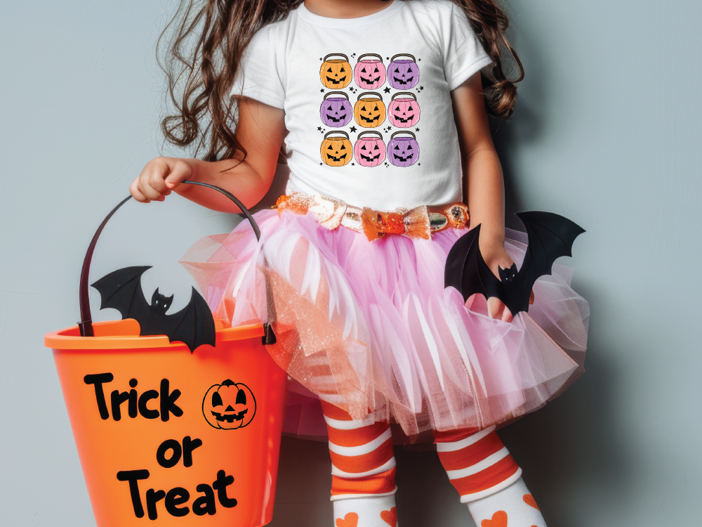 a little girl in a trick or treat costume holding a trick or treat bucket