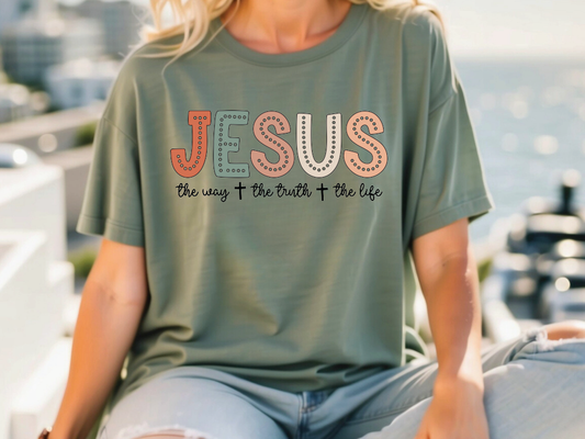 a woman wearing a t - shirt that says jesus the way to the truth