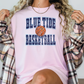 a woman wearing a blue tide basketball shirt