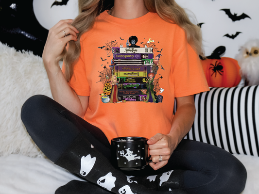 a woman sitting on a bed holding a coffee mug