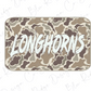 A camouflage-patterned sticker or decal with the word "LONGHORNS" written in bold, stylized letters.