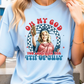 a woman wearing a blue t - shirt with a picture of a woman holding a