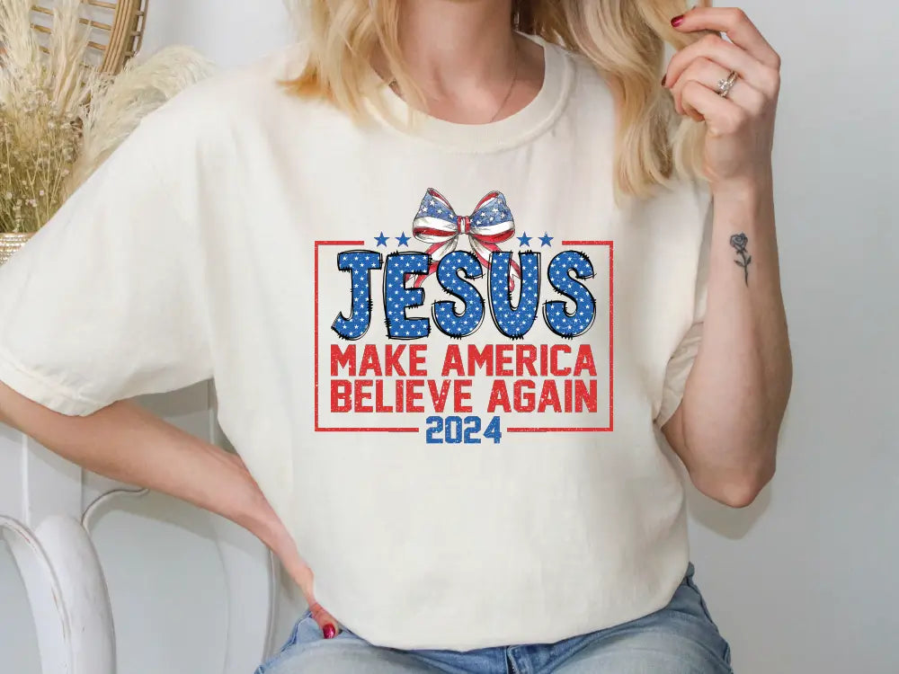 a woman wearing a t - shirt that says jesus make america believe again