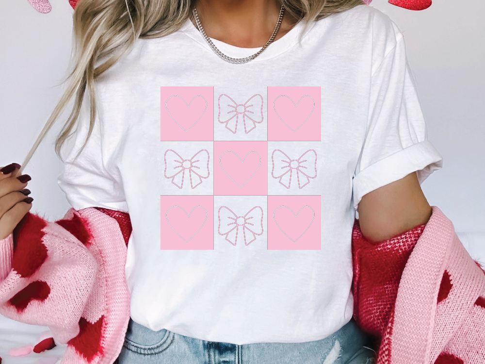 a woman wearing a t - shirt with hearts on it