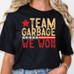 a woman wearing a black t - shirt that says team garbage we won