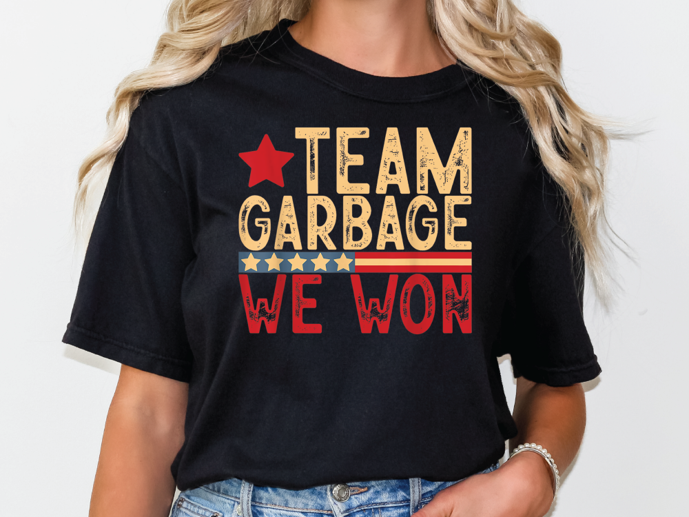 a woman wearing a black t - shirt that says team garbage we won