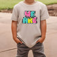 a young boy wearing a t - shirt that says be kind of kind of girl