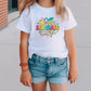 a little girl wearing a white shirt and shorts