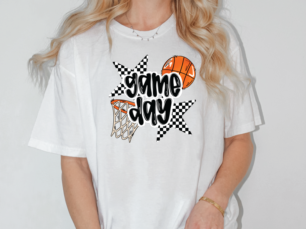 a woman wearing a game day t - shirt with basketballs on it