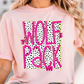 A woman wearing a pink t-shirt with the text "WOLF PACK" printed on it.