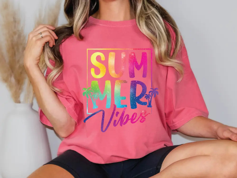 a woman wearing a pink shirt that says summer vibes