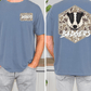 a man wearing a blue t-shirt with a graphic of a badger and the word "Badgers" printed on it.