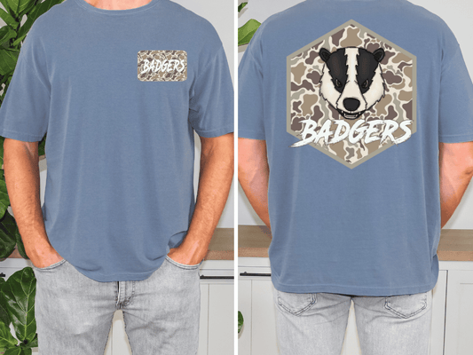 a man wearing a blue t-shirt with a graphic of a badger and the word "Badgers" printed on it.
