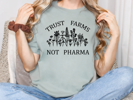 a woman wearing a t - shirt that says, trust farms not pharmia